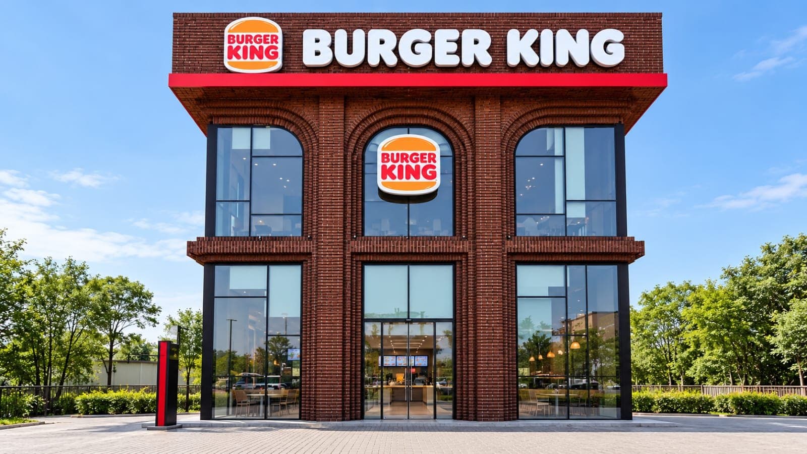 Two-storey Burger King restaurant with a red-brick facade and tall arched windows